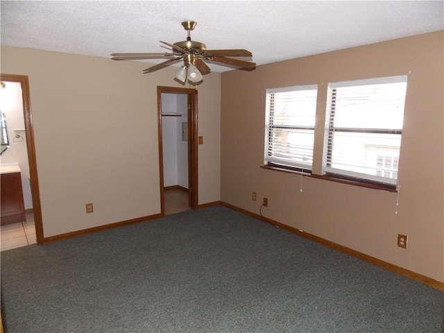 21401 Patton Ave Unit A & B, Lago Vista, TX 78645 - unfurnished room featuring light colored carpet, ceiling fan, and baseboards