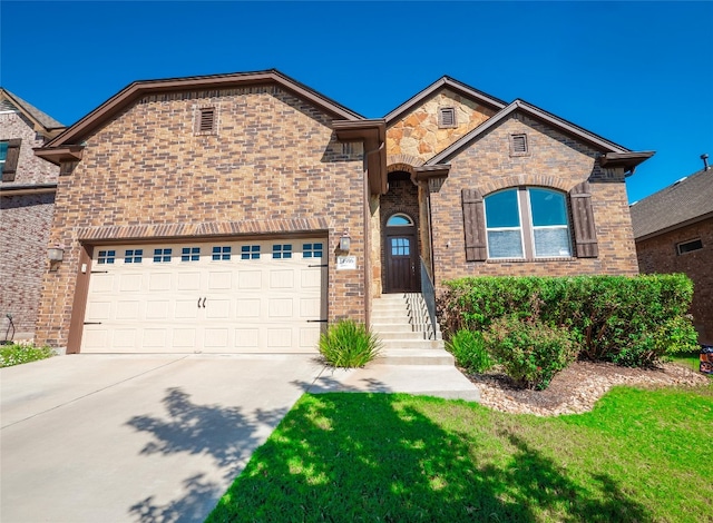 front of property featuring a front lawn and a garage