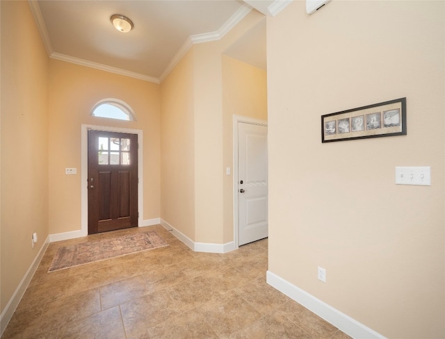 foyer with crown molding and a high ceiling