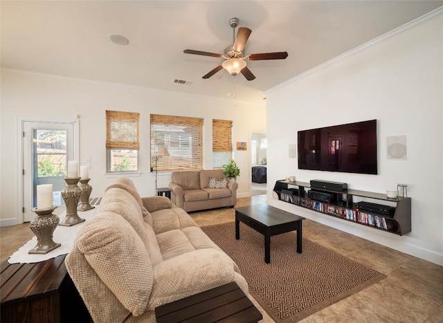 tiled living room with ornamental molding and ceiling fan