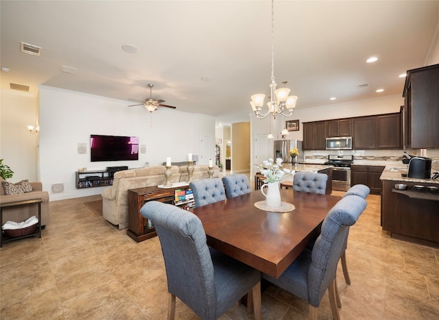 dining area featuring ornamental molding and ceiling fan with notable chandelier