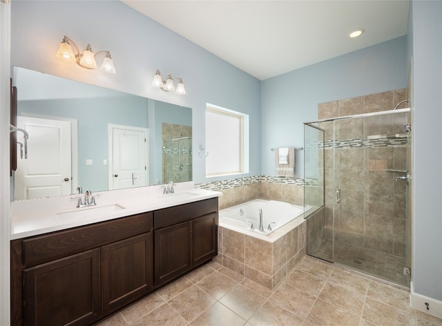 bathroom featuring vanity, tile patterned floors, and separate shower and tub