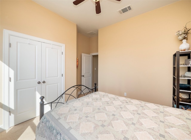 carpeted bedroom with a closet and ceiling fan