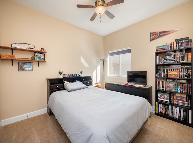 bedroom featuring light carpet and ceiling fan