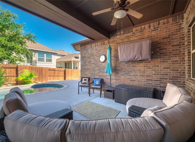 view of patio featuring ceiling fan, a swimming pool, and an outdoor hangout area