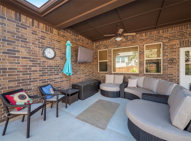 view of patio with outdoor lounge area and ceiling fan