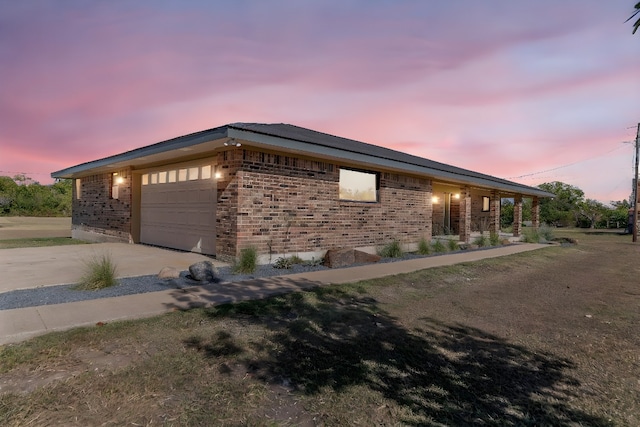 property exterior at dusk with a garage