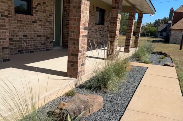 view of property exterior with a patio