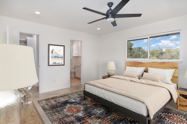 bedroom featuring ensuite bath and ceiling fan