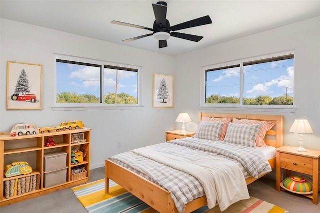 carpeted bedroom with ceiling fan