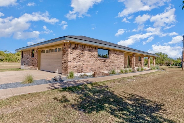 view of home's exterior featuring a yard and a garage