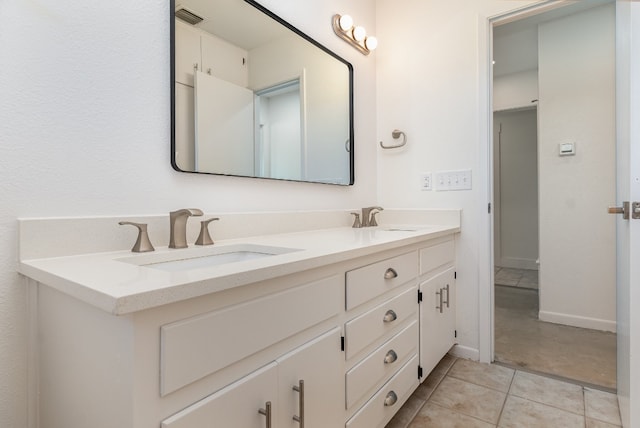 bathroom featuring vanity and tile patterned flooring