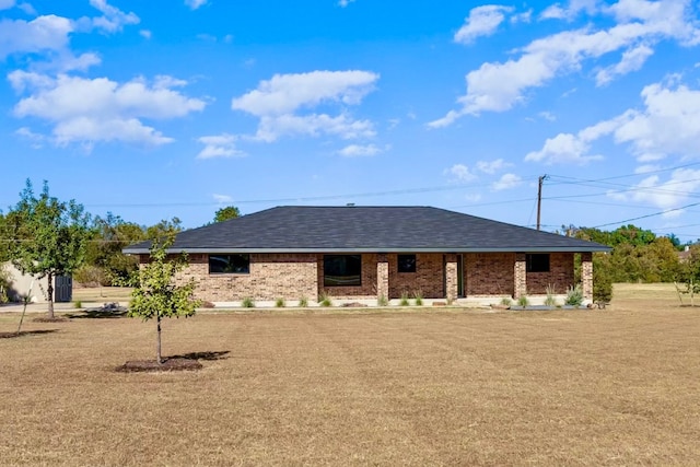 back of house featuring a yard