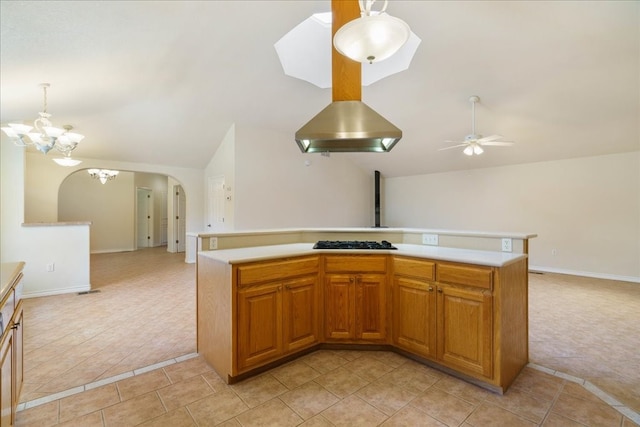 kitchen with decorative light fixtures, light tile patterned flooring, black gas stovetop, and ceiling fan with notable chandelier