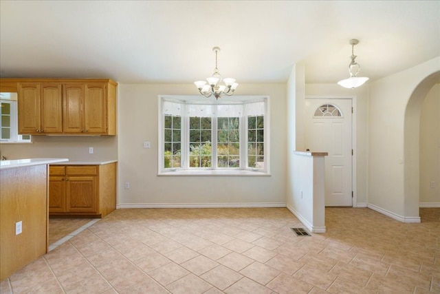 kitchen featuring a chandelier and hanging light fixtures