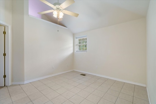 tiled empty room featuring ceiling fan and vaulted ceiling