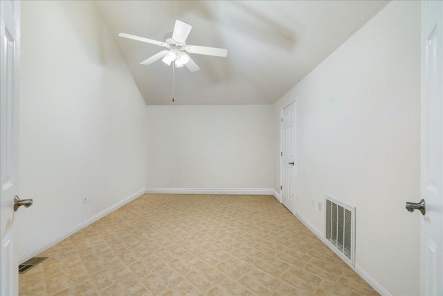 spare room with ceiling fan and lofted ceiling