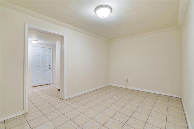 unfurnished room with light tile patterned floors