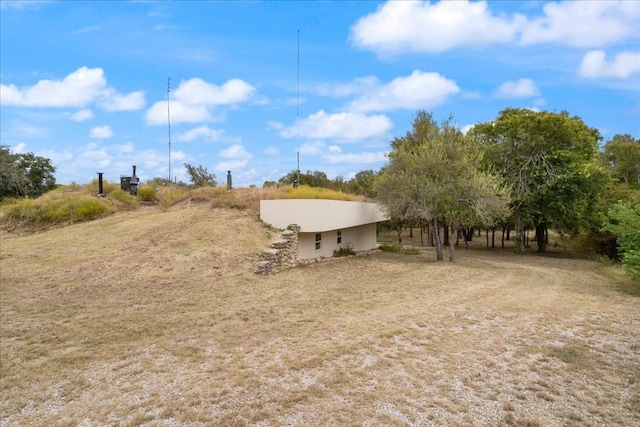 view of yard with a rural view