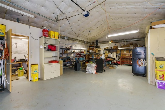 garage featuring a workshop area and a garage door opener