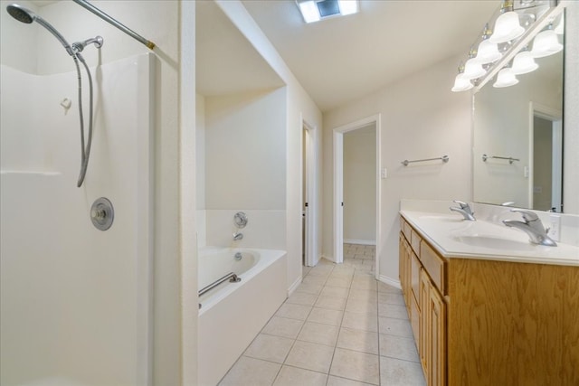 bathroom with tile patterned flooring, vanity, and separate shower and tub