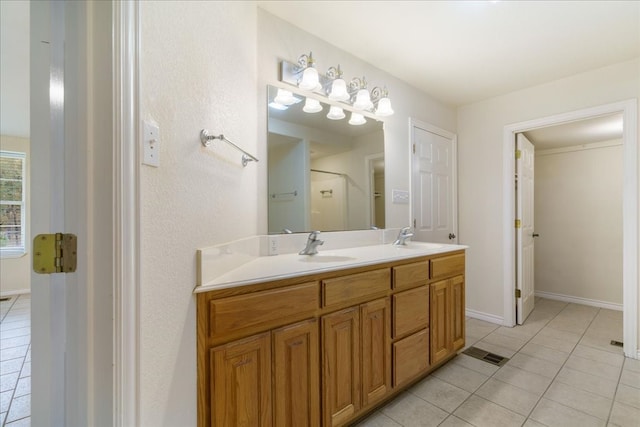 bathroom featuring tile patterned floors and vanity