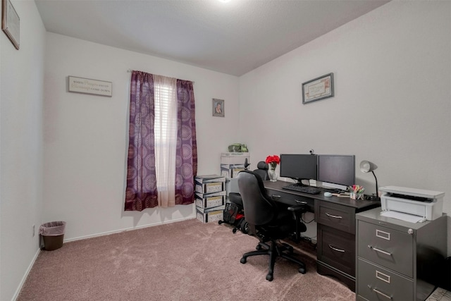 carpeted home office featuring baseboards and visible vents