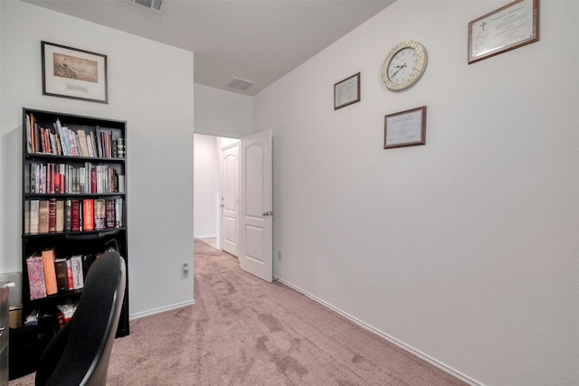 carpeted office featuring baseboards and visible vents