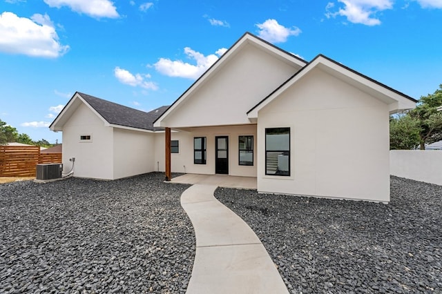 back of property with a patio and cooling unit