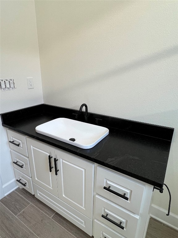 interior details featuring wood-type flooring and sink