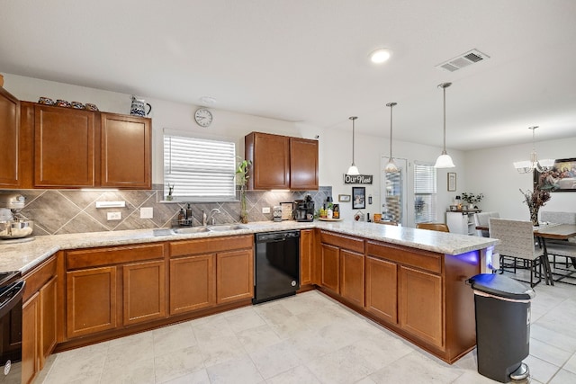 kitchen with black appliances, sink, kitchen peninsula, pendant lighting, and decorative backsplash