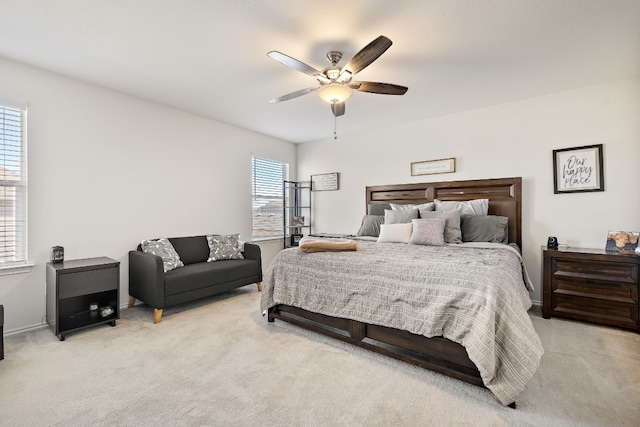 bedroom with light carpet and ceiling fan