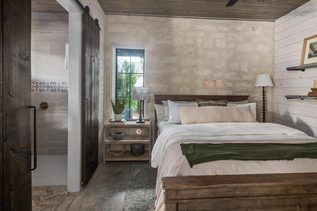 bedroom with a barn door, ceiling fan, and wooden ceiling