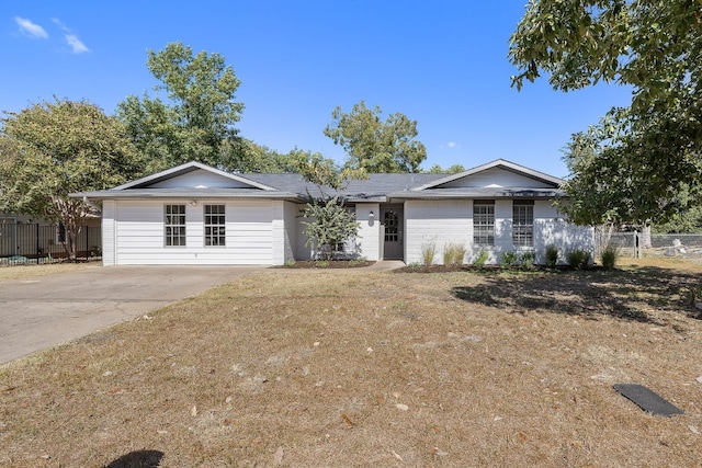 ranch-style home with a front lawn