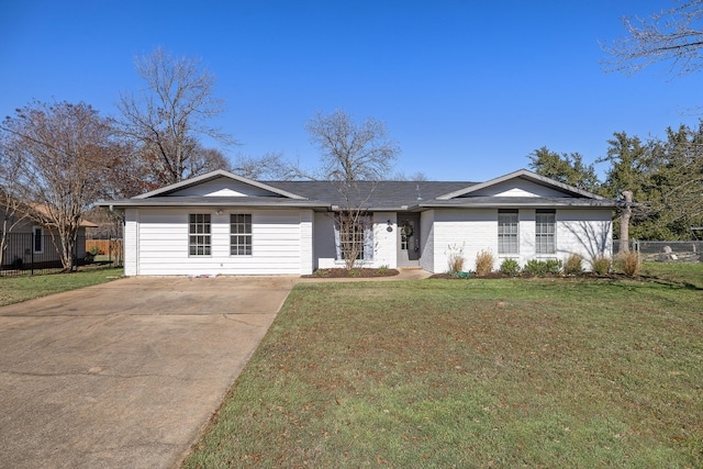 ranch-style home featuring a front yard