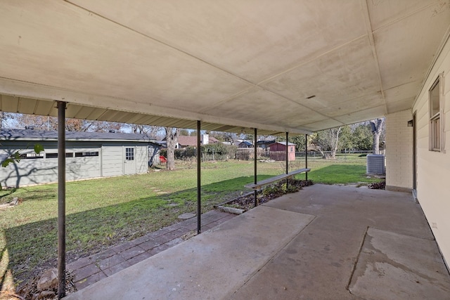 view of patio with an outbuilding and central air condition unit