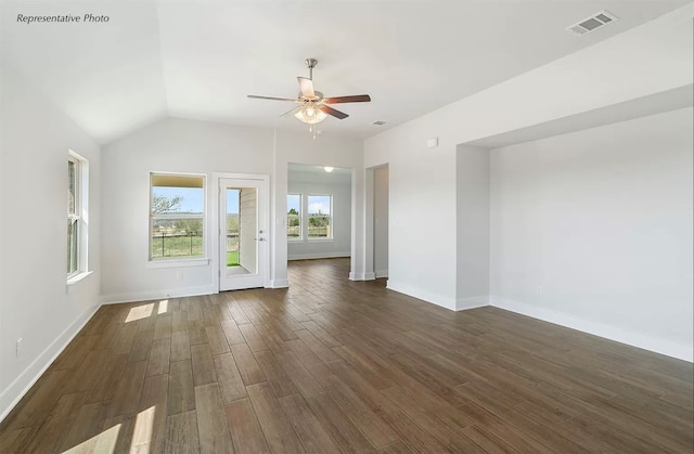 unfurnished room featuring lofted ceiling, dark hardwood / wood-style floors, and ceiling fan