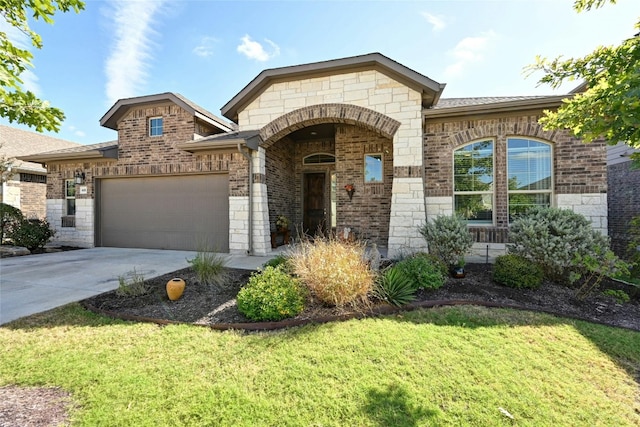 view of front of property with a garage and a front yard