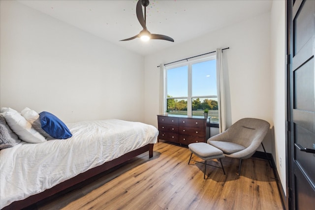 bedroom with light wood-type flooring and ceiling fan