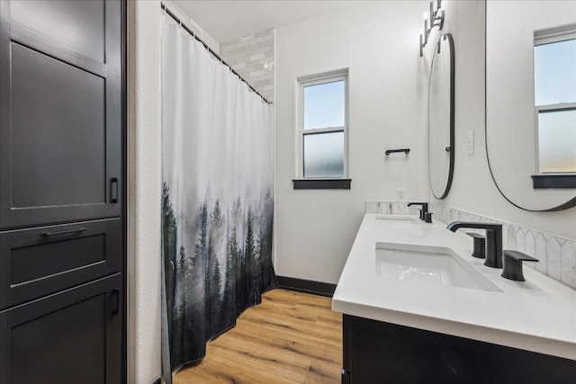 bathroom with vanity and hardwood / wood-style floors