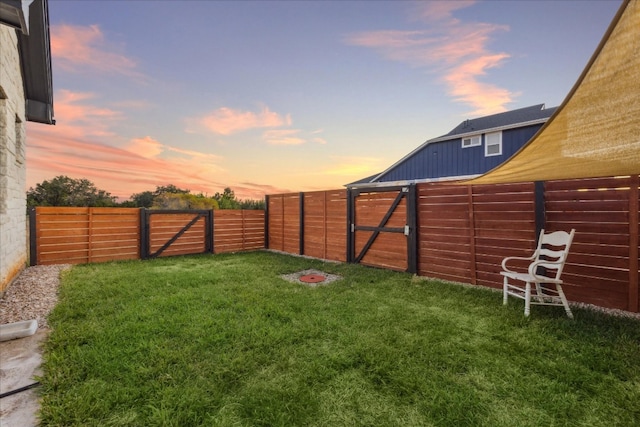 view of yard at dusk