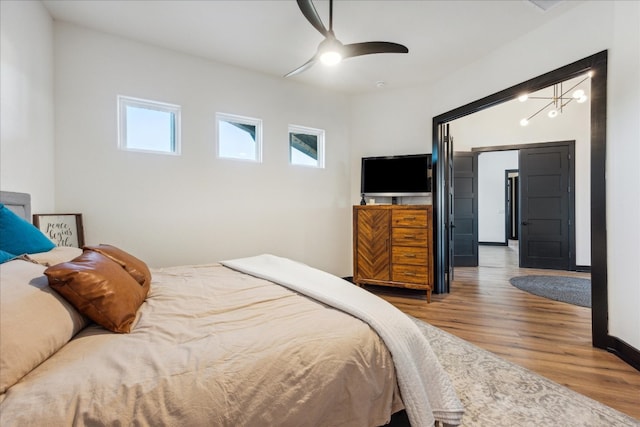 bedroom with hardwood / wood-style floors and ceiling fan