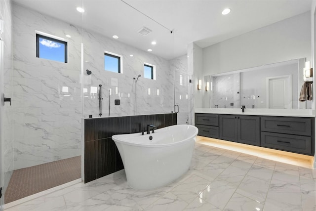 bathroom featuring plenty of natural light, vanity, and independent shower and bath