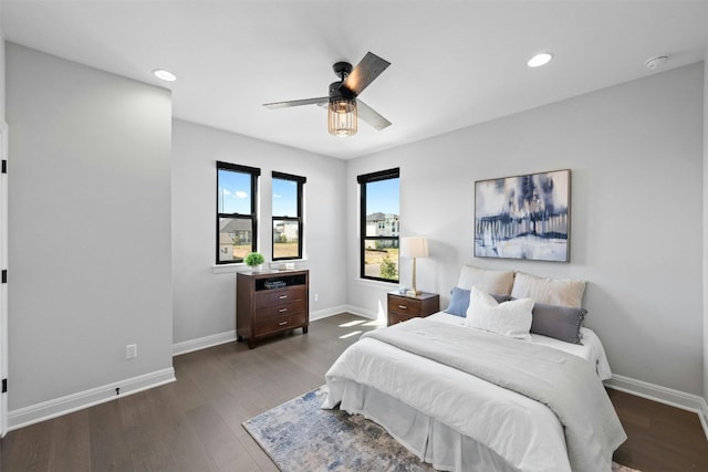 bedroom featuring dark hardwood / wood-style flooring and ceiling fan