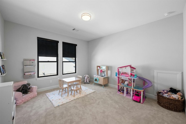 game room featuring light colored carpet