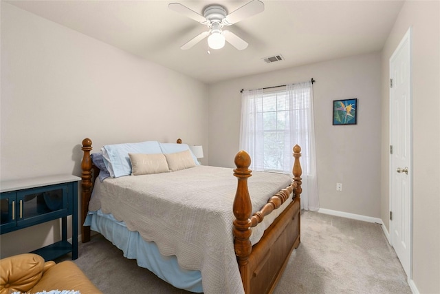 bedroom featuring visible vents, carpet flooring, baseboards, and ceiling fan