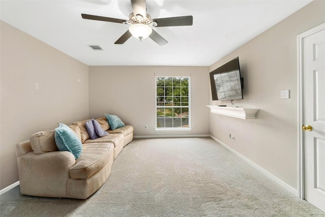 living room featuring visible vents, ceiling fan, baseboards, and carpet floors