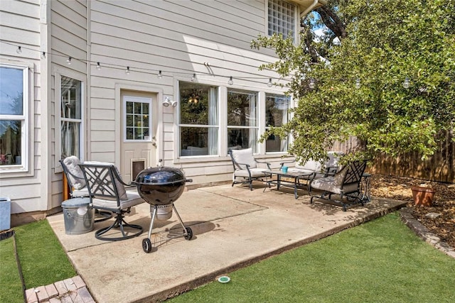 view of patio featuring fence