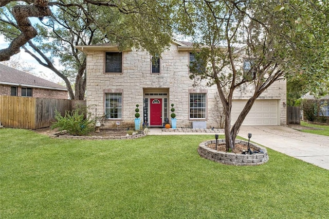 view of front facade with stone siding, concrete driveway, a front yard, and fence