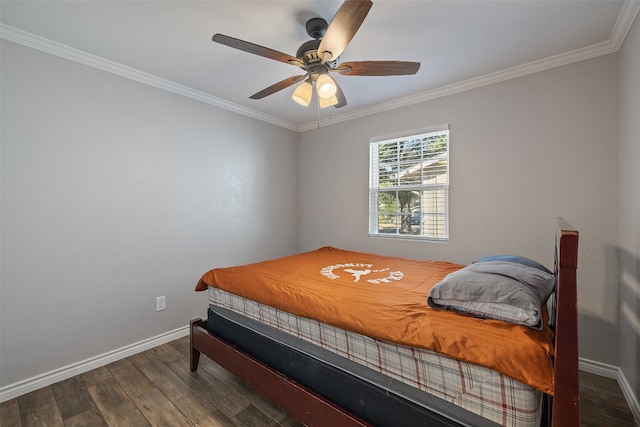 bedroom with dark hardwood / wood-style flooring, crown molding, and ceiling fan